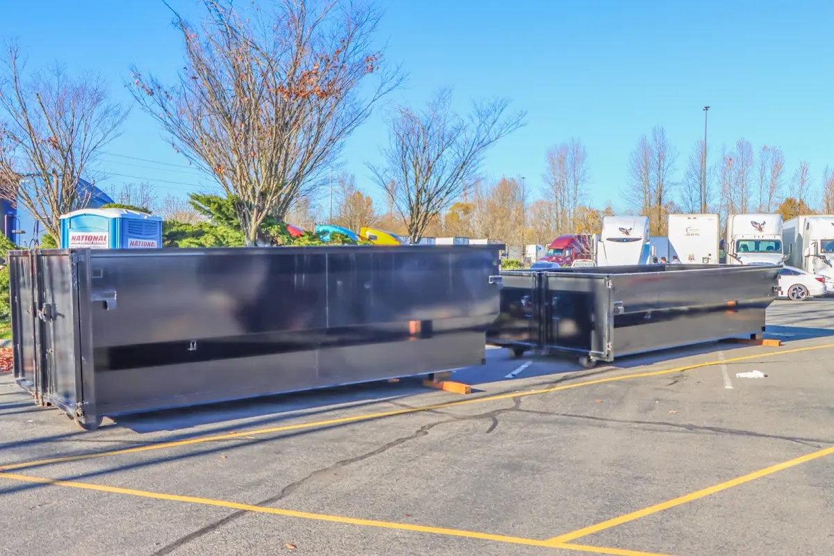 Professional dumpster rental service with roll-off container on residential driveway in Ringwood